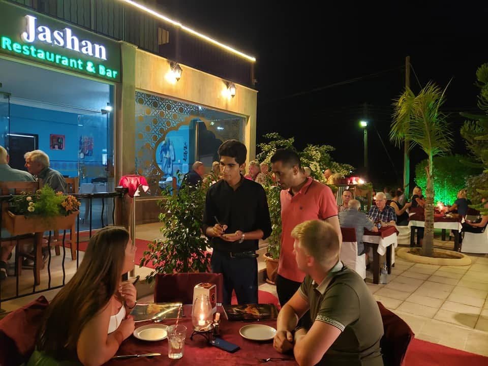 Waiters taking an order on the terrace at Jashan Famagusta